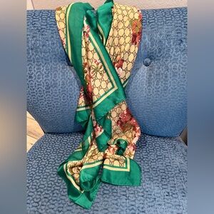100% SILK Scarf. GG logo. Can be worn multiple ways. Green border. Stunning